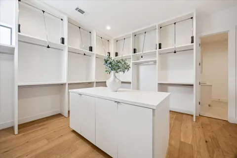 a view of cabinets with wooden floor