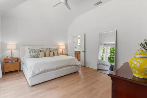 a bedroom with a bed and a couch