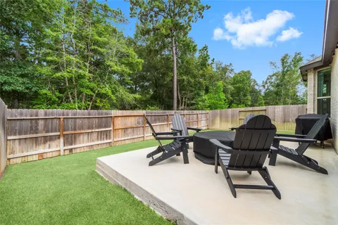 a view of chair and tables in the back yard