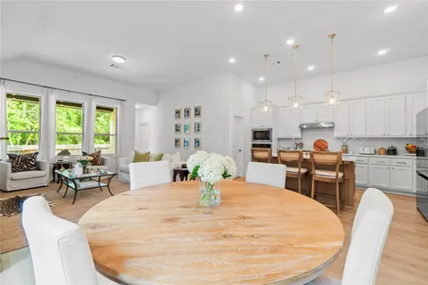 a bed room with furniture and a large window