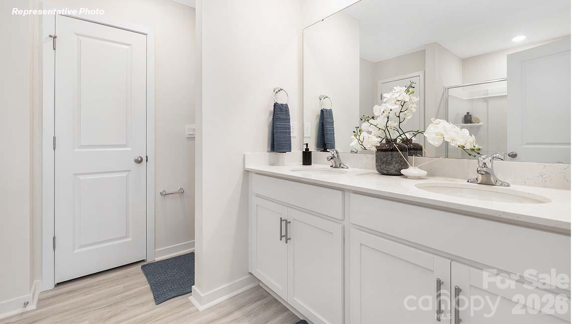 3269 Ora Smith Road Lincolnton, NC 28092 - Photo 12 of 21 a bathroom with double vanity sink and a mirror