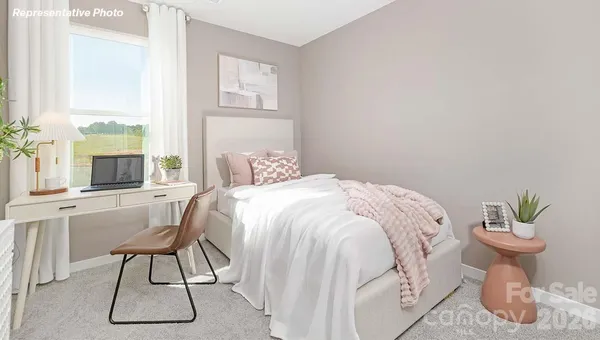 a bedroom with a bed and a table in it