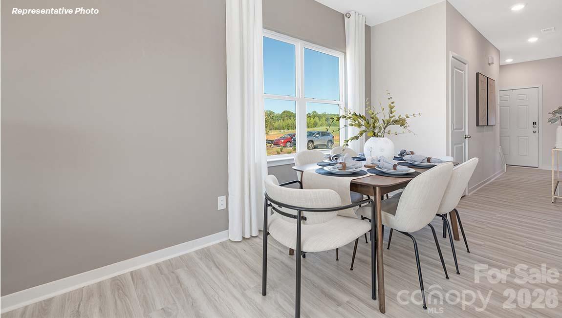 3269 Ora Smith Road Lincolnton, NC 28092 - Photo 6 of 21 a view of a dining room with furniture and a potted plant