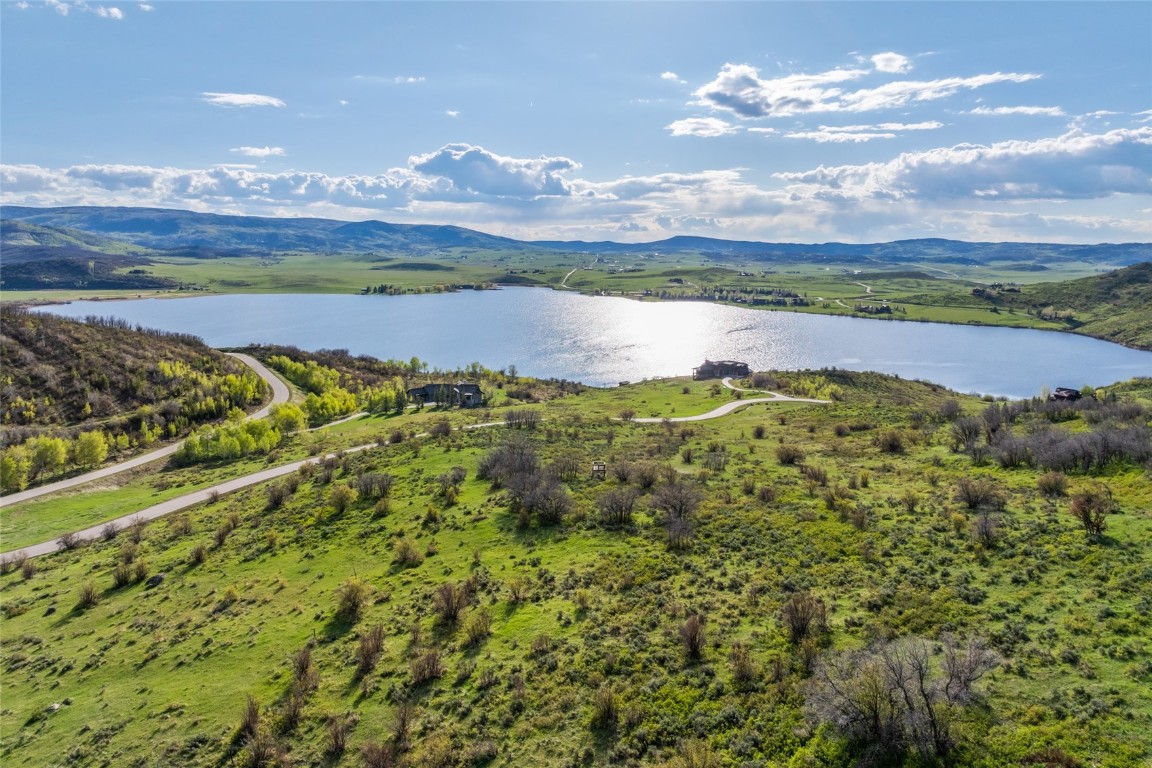 30105 Harrison Trail Steamboat Springs, CO 80487 - Photo 1 of 25 a view of a lake with a mountain in the background