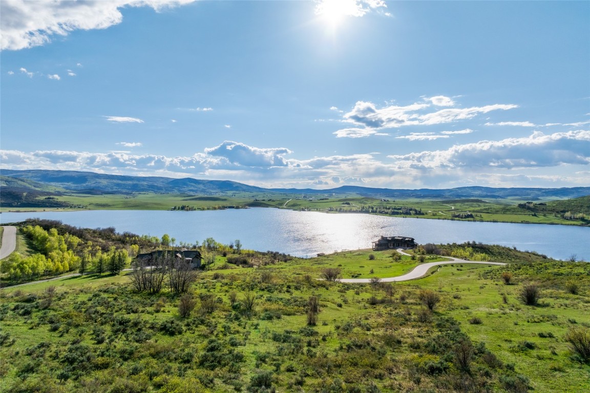 30105 Harrison Trail Steamboat Springs, CO 80487 - Photo 2 of 25 a view of a lake with a mountain in the background