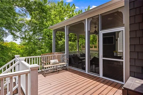a view of deck with wooden floor and outdoor seating