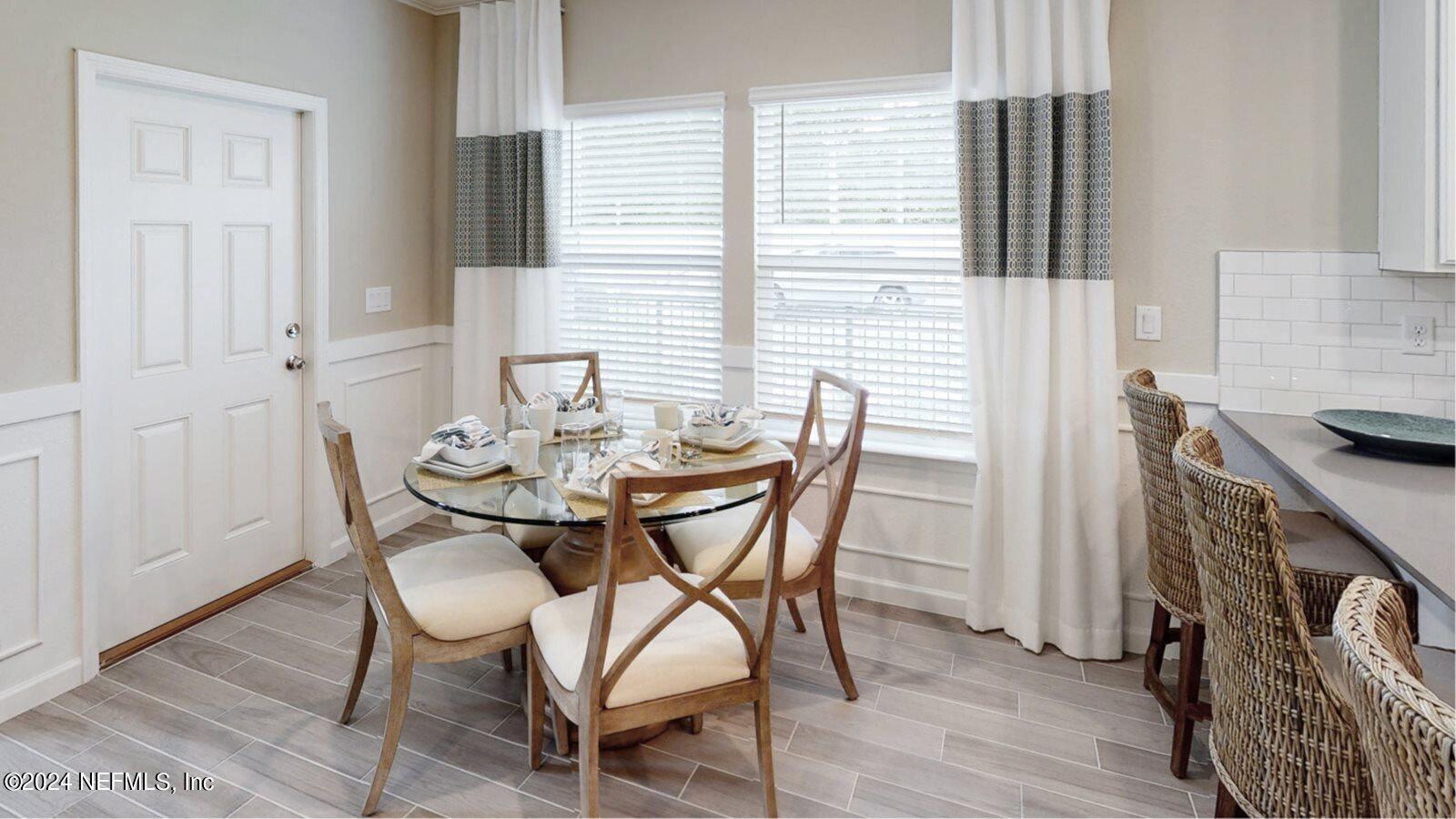 264 Belfort Court St. Augustine, FL 32092 - Photo 4 of 15 a view of a dining room with furniture and wooden floor