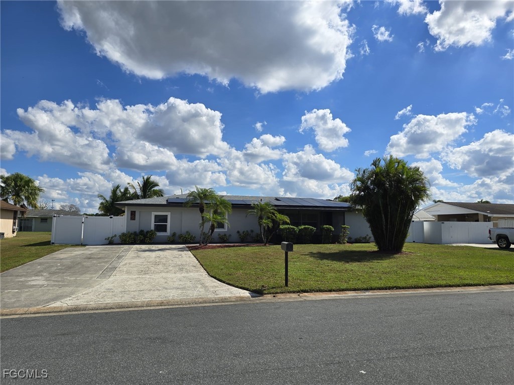 a view of a house with a big yard