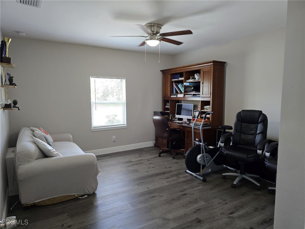 112 Rowland Road Lehigh Acres, FL 33936 - Photo 15 of 31 a livingroom with workspace and a window