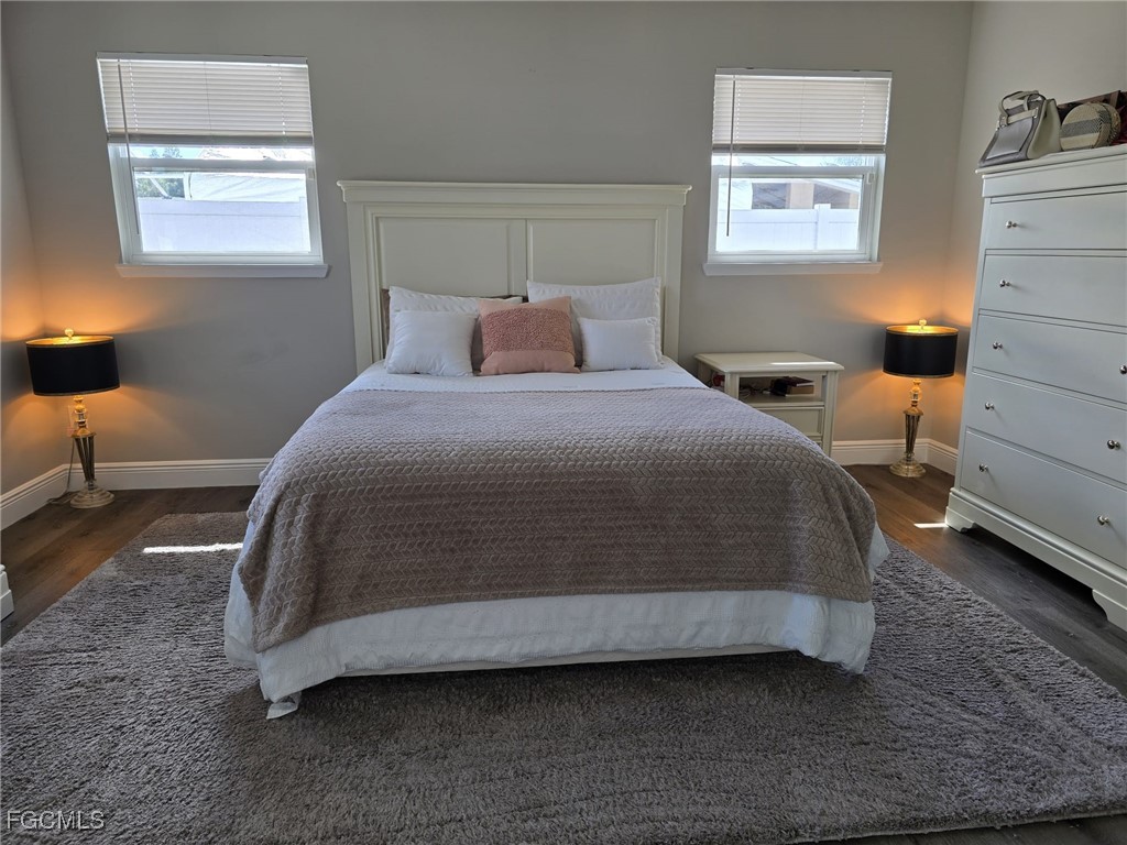 112 Rowland Road Lehigh Acres, FL 33936 - Photo 17 of 31 a bedroom with a bed and window