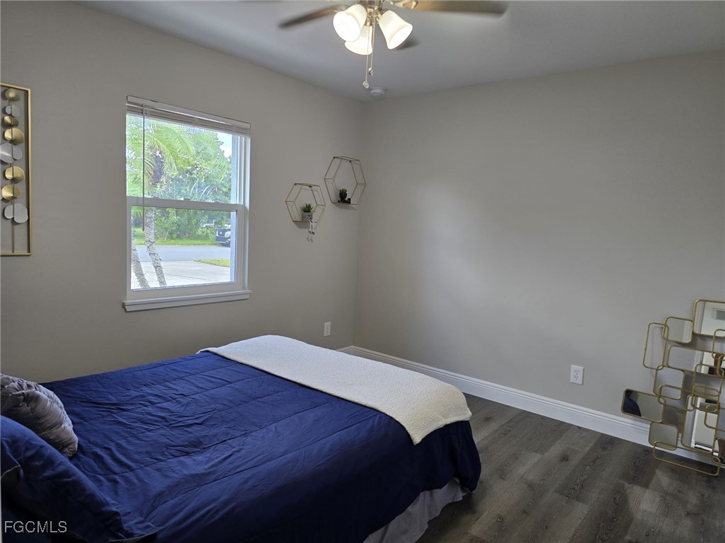 112 Rowland Road Lehigh Acres, FL 33936 - Photo 20 of 31 a bedroom with a bed and a window
