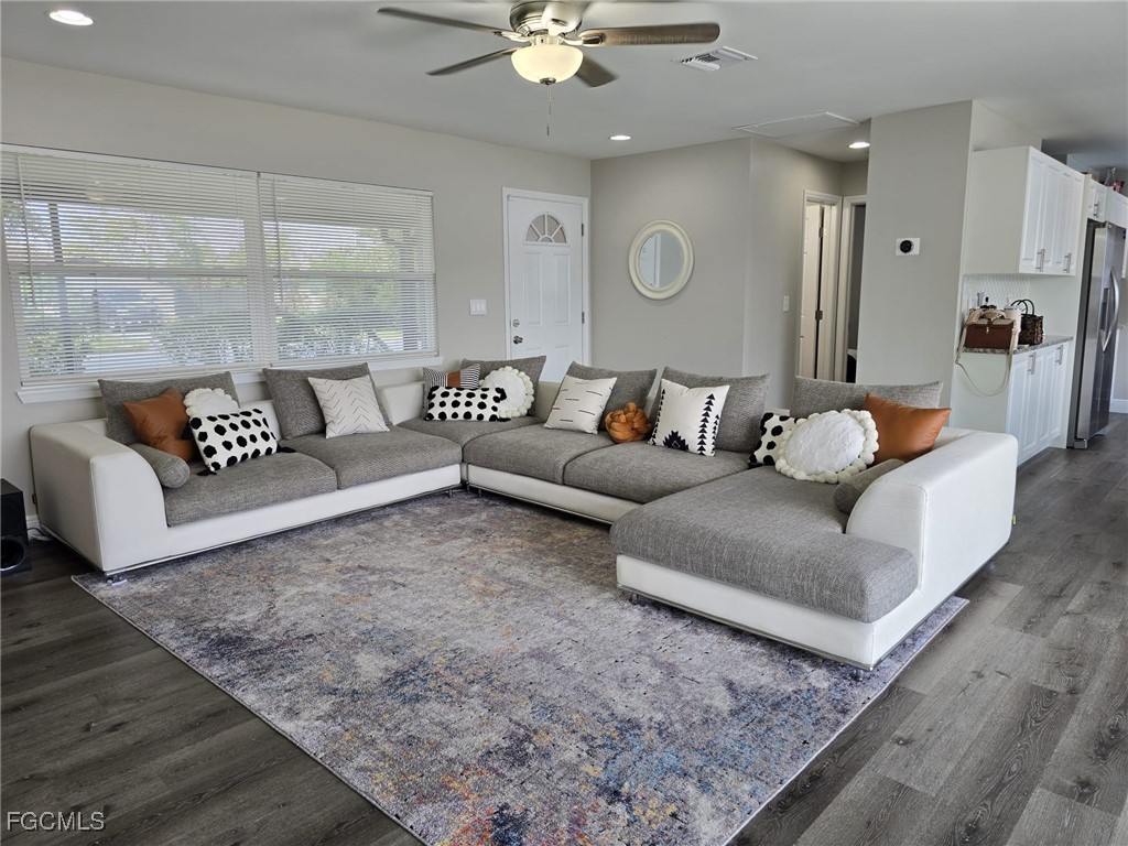 112 Rowland Road Lehigh Acres, FL 33936 - Photo 5 of 31 a living room with furniture and a rug