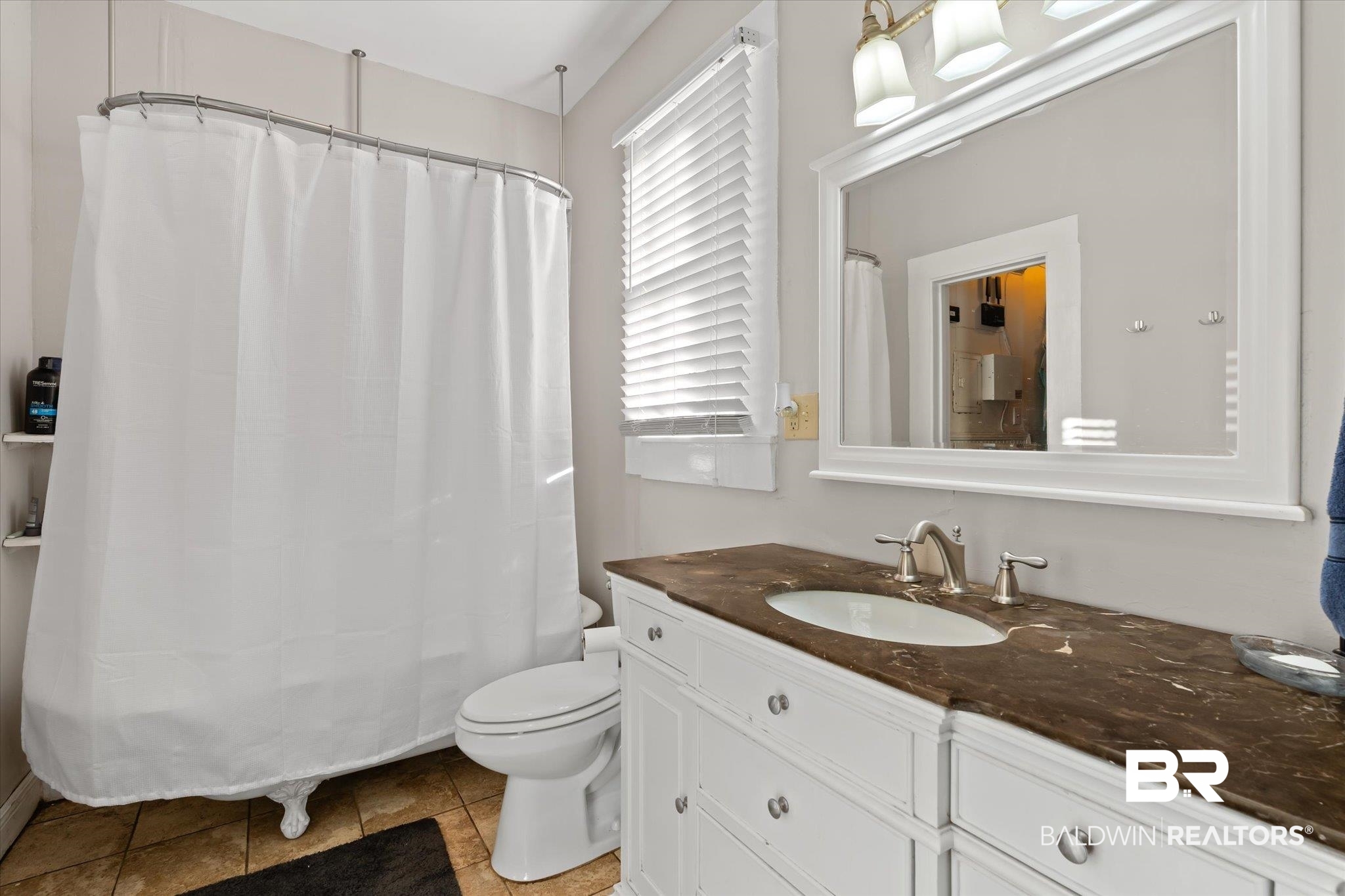 7 Rickarby Place Mobile, AL 36606 - Photo 13 of 20 Bathroom with tile patterned floors, vanity, and toilet