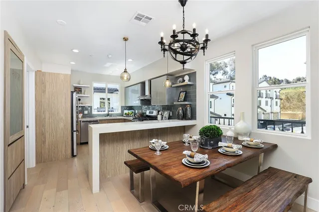 a kitchen with granite countertop a refrigerator and a sink