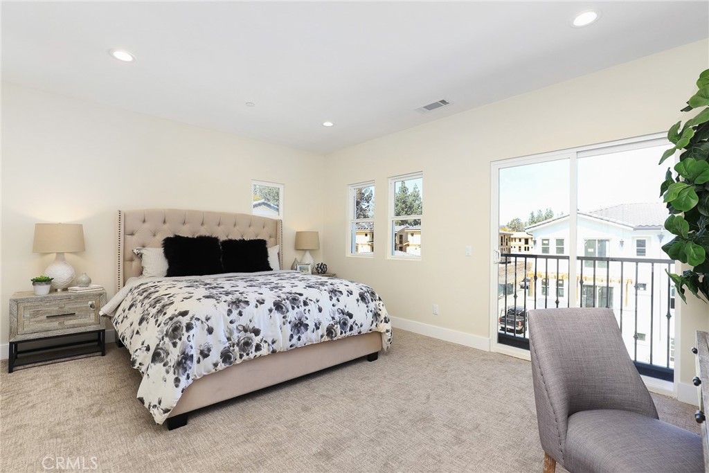 24 Spyglass Avenue Phillips Ranch, CA 91766 - Photo 25 of 63 a bedroom with a bed and a couch