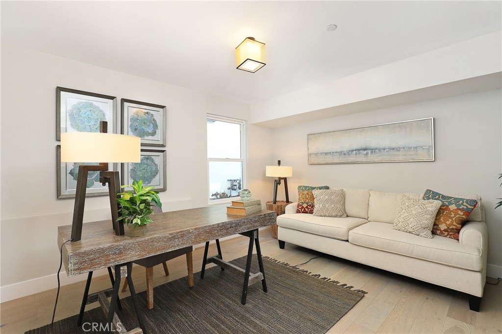 24 Spyglass Avenue Phillips Ranch, CA 91766 - Photo 48 of 63 a living room with furniture and wooden floor