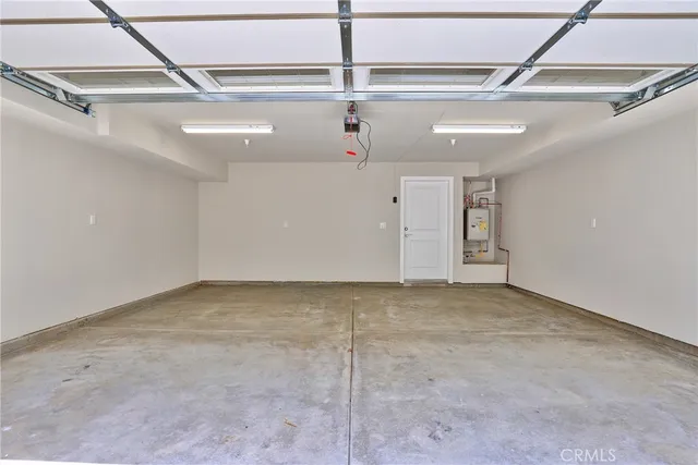 an outdoor space with patio and white umbrellas
