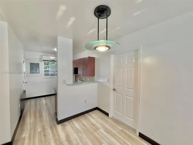 a kitchen with stainless steel appliances granite countertop a refrigerator sink stove and microwave