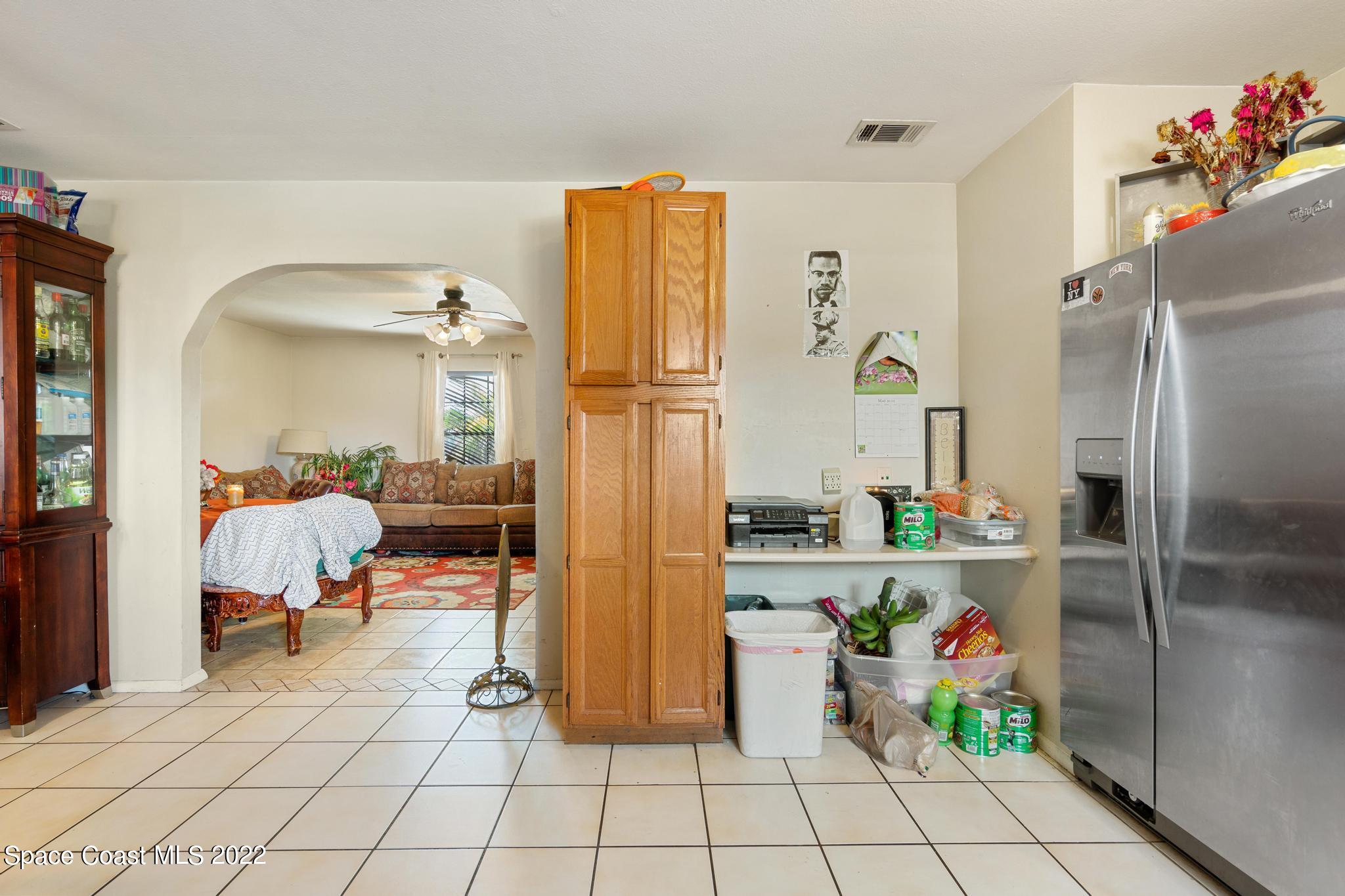 1148 Newbern Street Northeast Palm Bay, FL 32905 - Photo 10 of 38 a living room with furniture and a potted plant