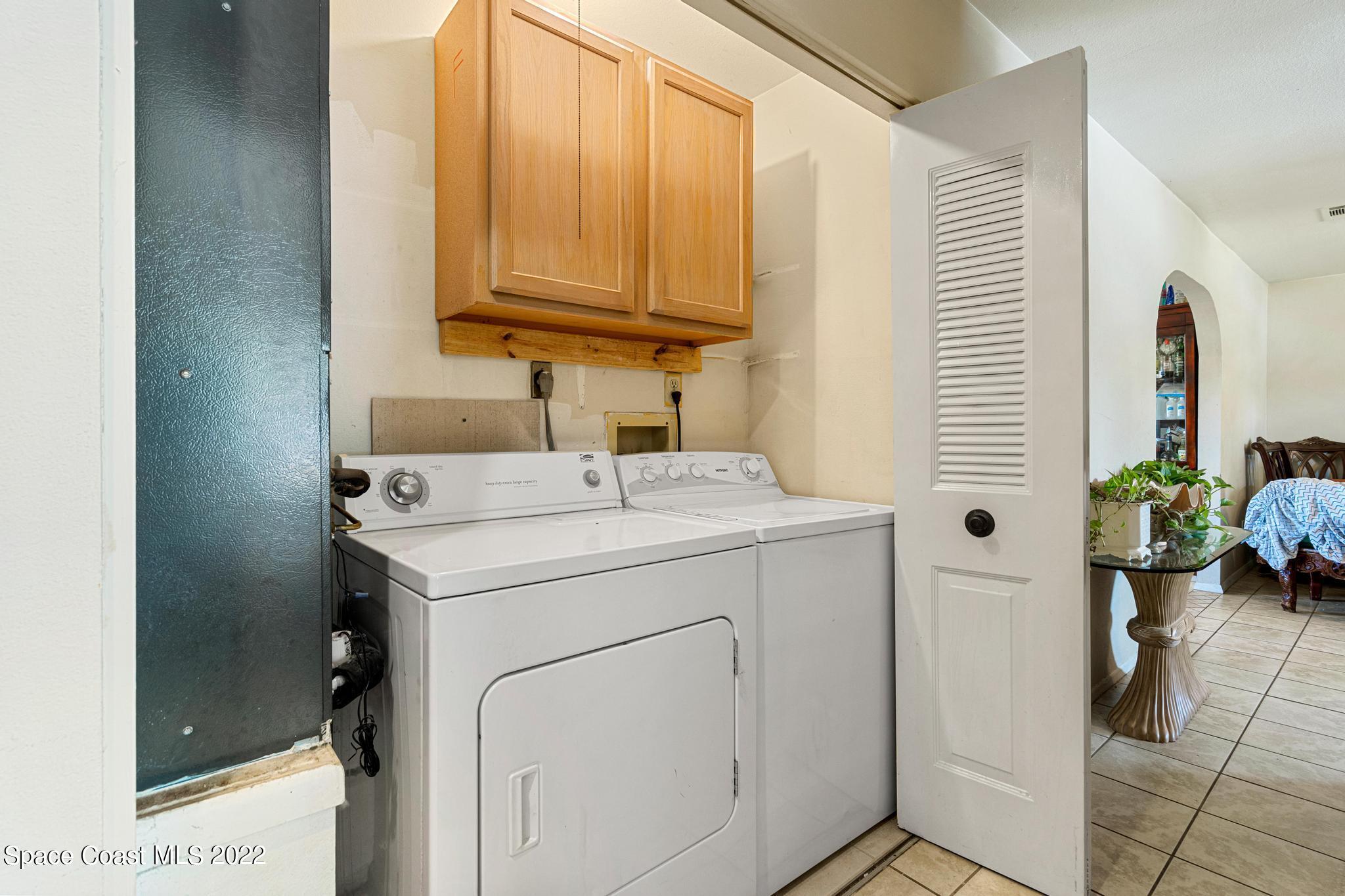 1148 Newbern Street Northeast Palm Bay, FL 32905 - Photo 18 of 38 a utility room with dryer and washer