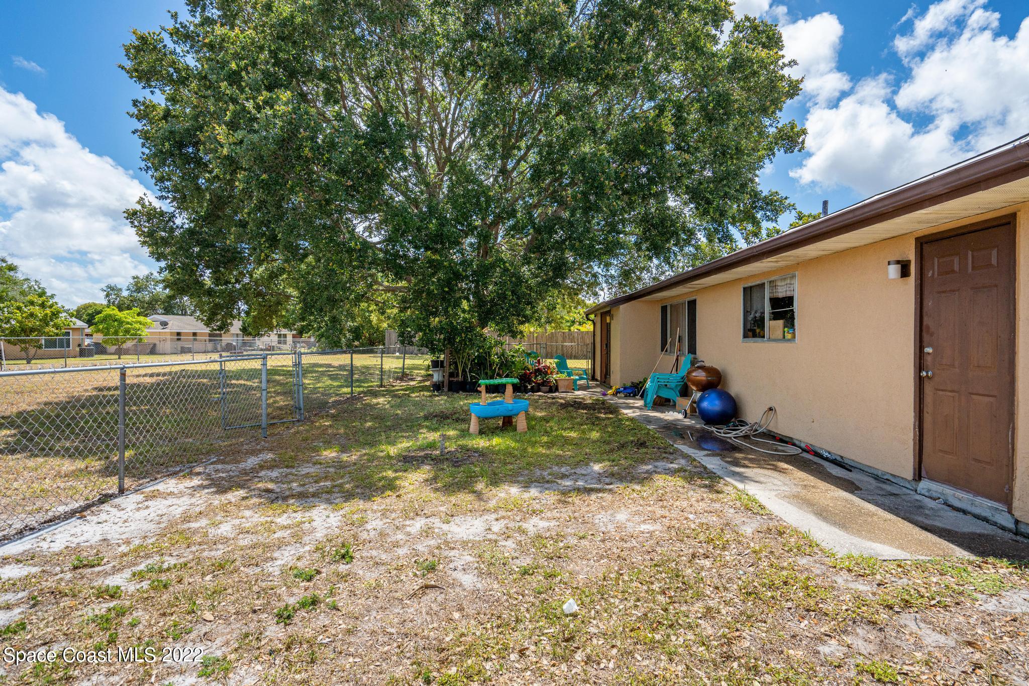 1148 Newbern Street Northeast Palm Bay, FL 32905 - Photo 23 of 38 a view of swimming pool with a patio