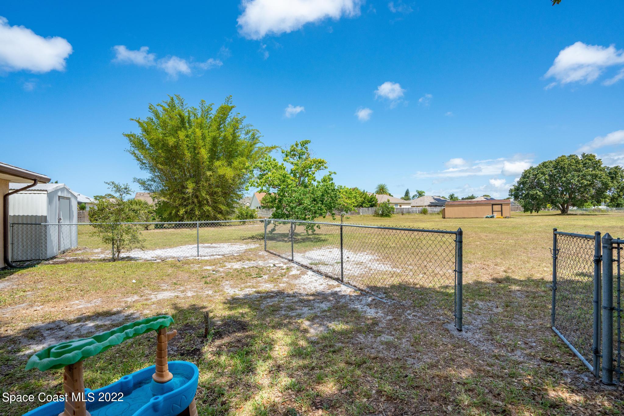 1148 Newbern Street Northeast Palm Bay, FL 32905 - Photo 24 of 38 a view of a yard