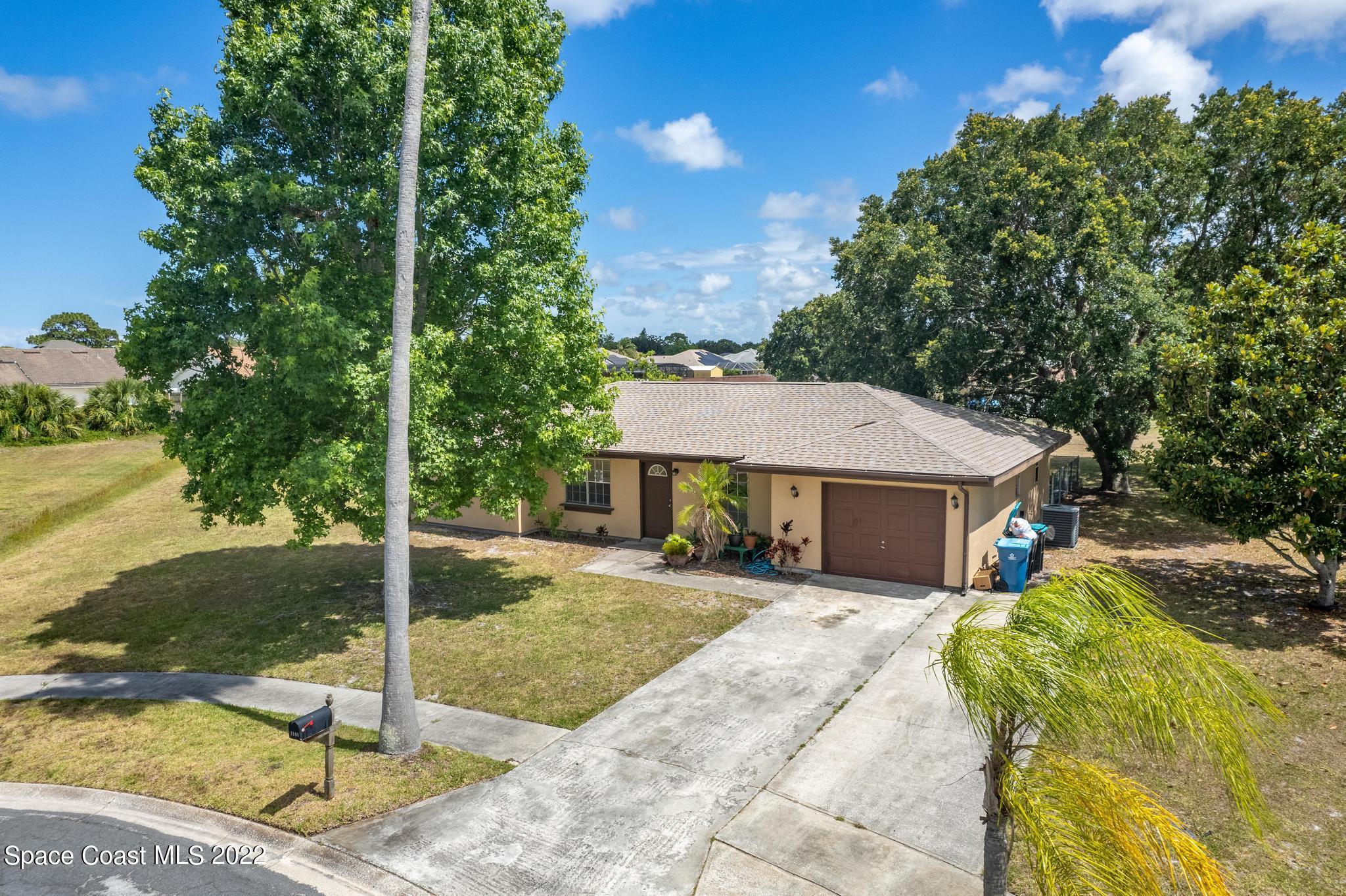 1148 Newbern Street Northeast Palm Bay, FL 32905 - Photo 29 of 38 a view of a house with backyard