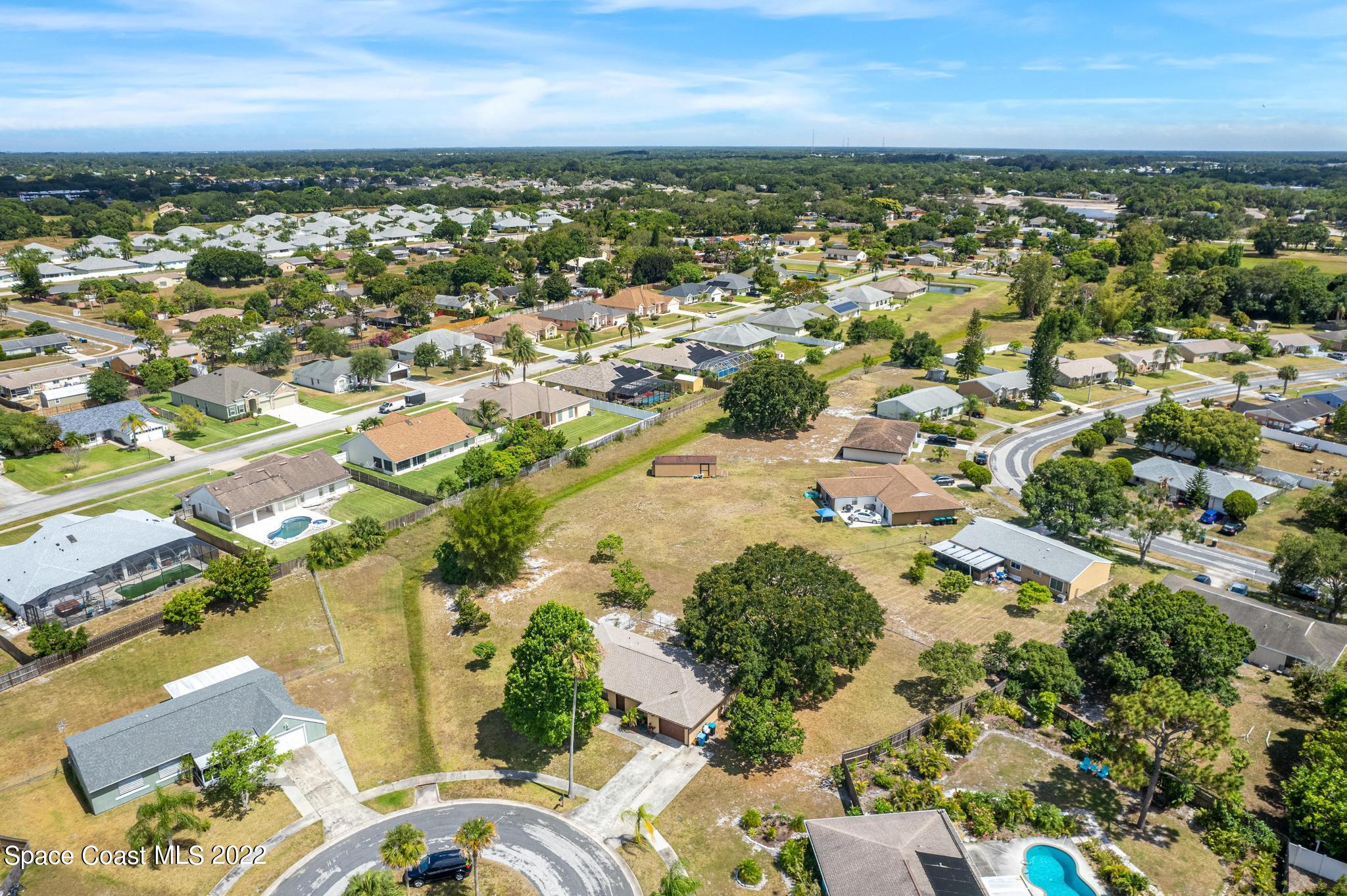 1148 Newbern Street Northeast Palm Bay, FL 32905 - Photo 36 of 38 an aerial view of residential building with outdoor space