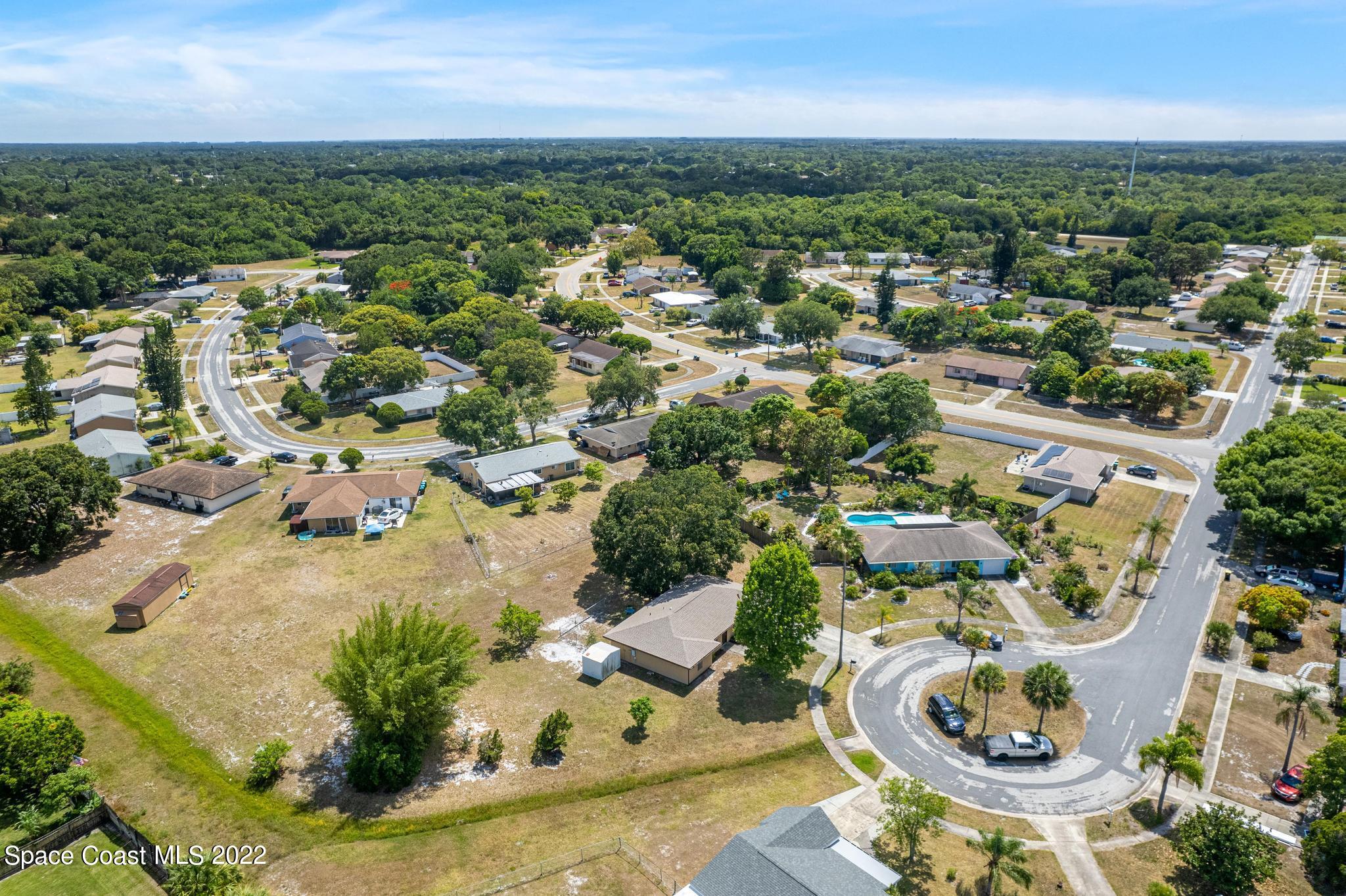 1148 Newbern Street Northeast Palm Bay, FL 32905 - Photo 37 of 38 an aerial view of residential houses with outdoor space
