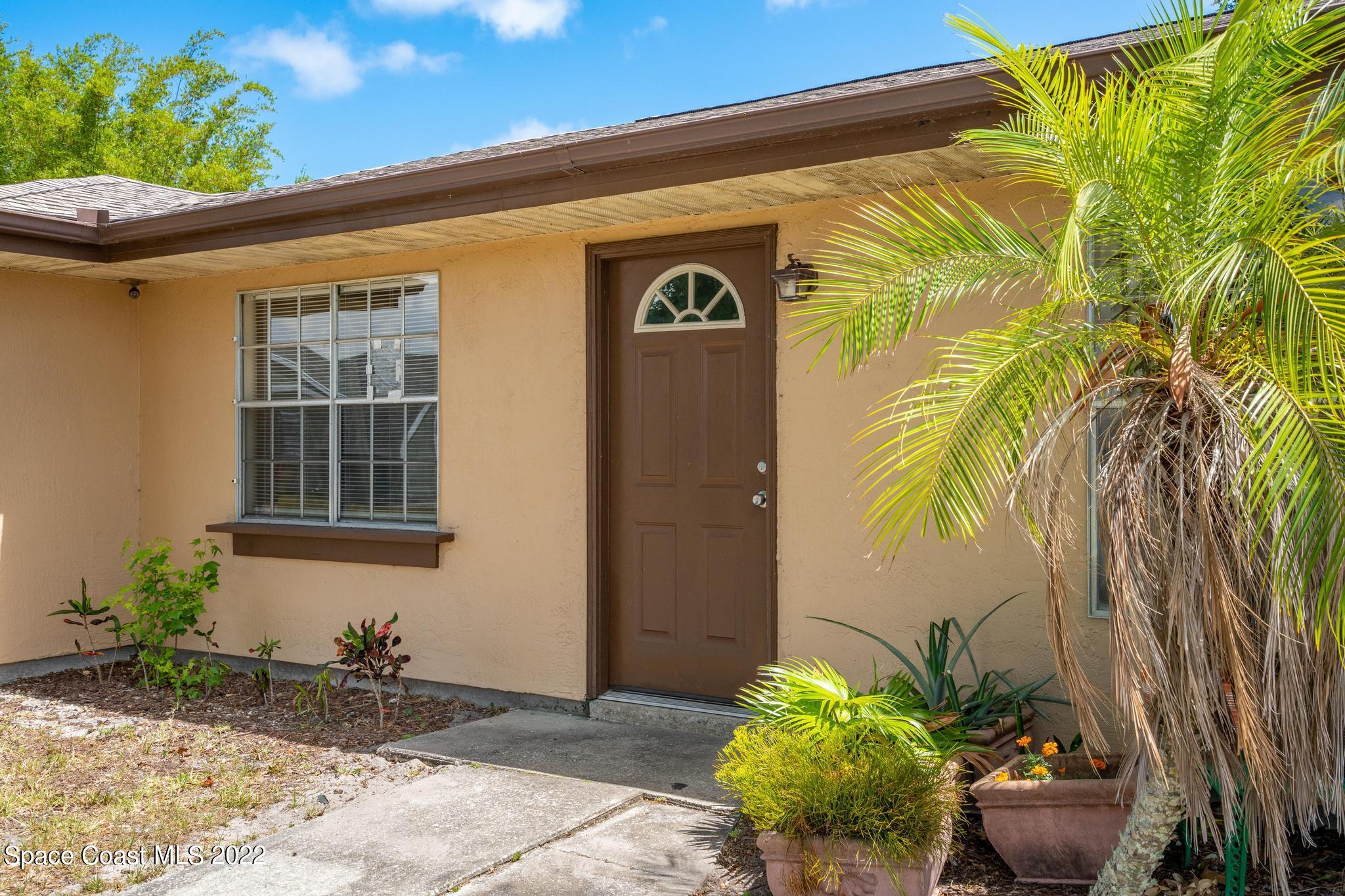 1148 Newbern Street Northeast Palm Bay, FL 32905 - Photo 5 of 38 a front view of a house
