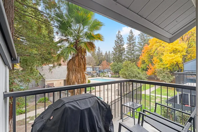 a view of a balcony with a pot