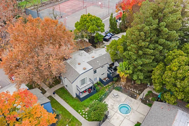 an aerial view of a house with a yard