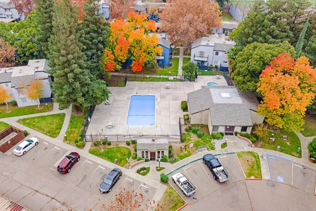 an aerial view of a house with a swimming pool