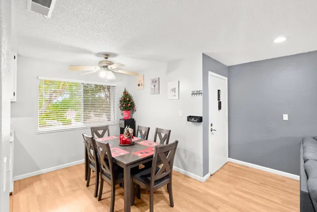 a view of a dining room with furniture and window