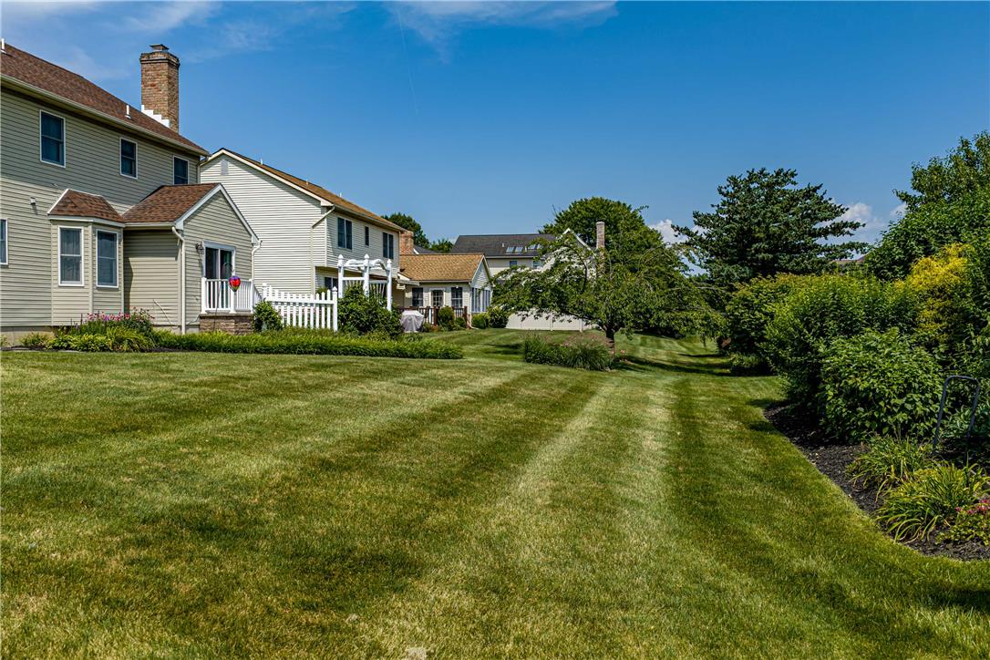 4568 Greenfield Road Bethlehem, PA 18017 - Photo 41 of 59 A sweeping backyard with manicured lawns and mature landscaping offers private outdoor enjoyment.