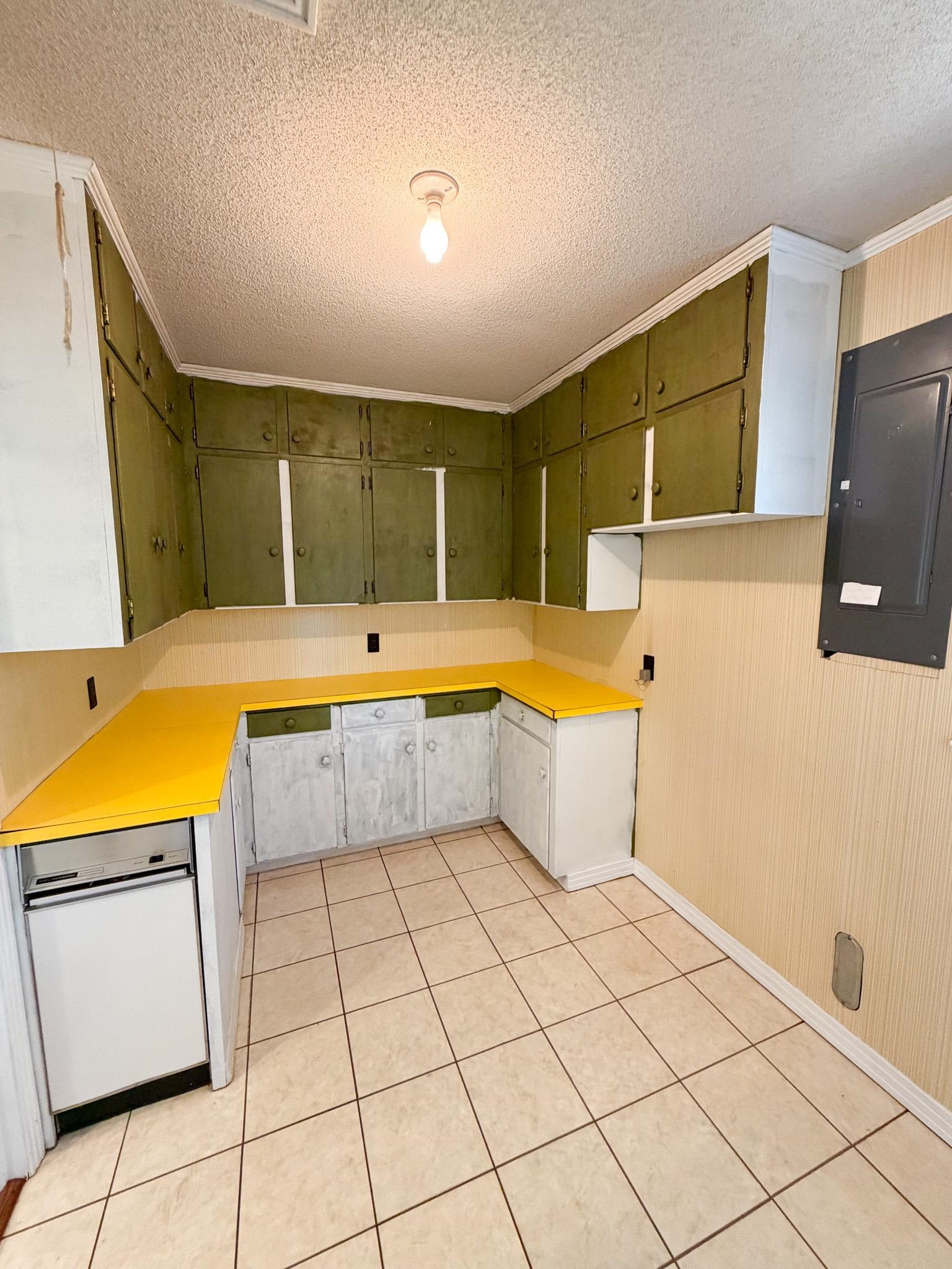 503 East Quitman Street Iuka, MS 38852 - Photo 18 of 20 a view of a kitchen with fridge and window