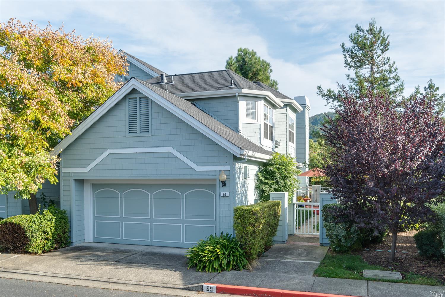 99 Mariners Circle San Rafael, CA 94903 - Photo 1 of 1 a front view of a house with a garden