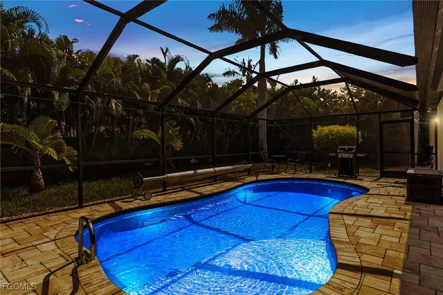 a view of swimming pool with outdoor seating