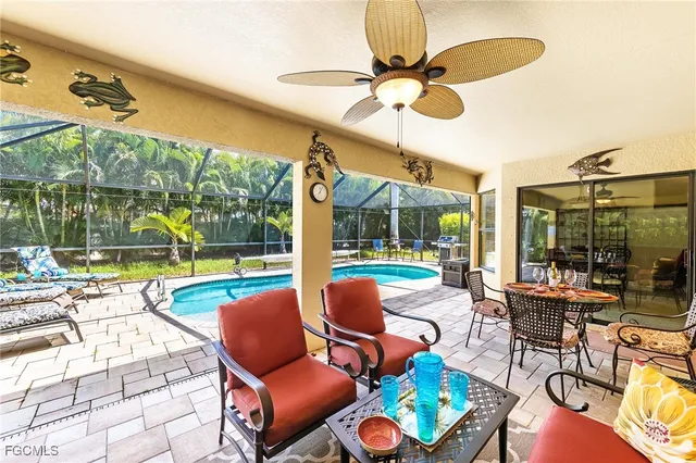 a view of a patio with a table chairs and a backyard