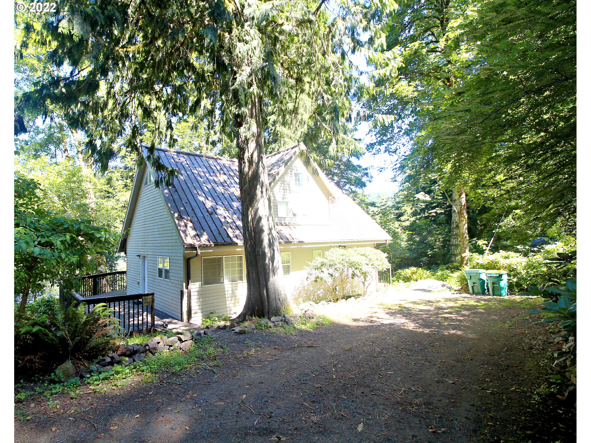 71403 Fishhawk Road Birkenfeld, OR 97016 - Photo 2 of 31 a view of a house with a tree in the background