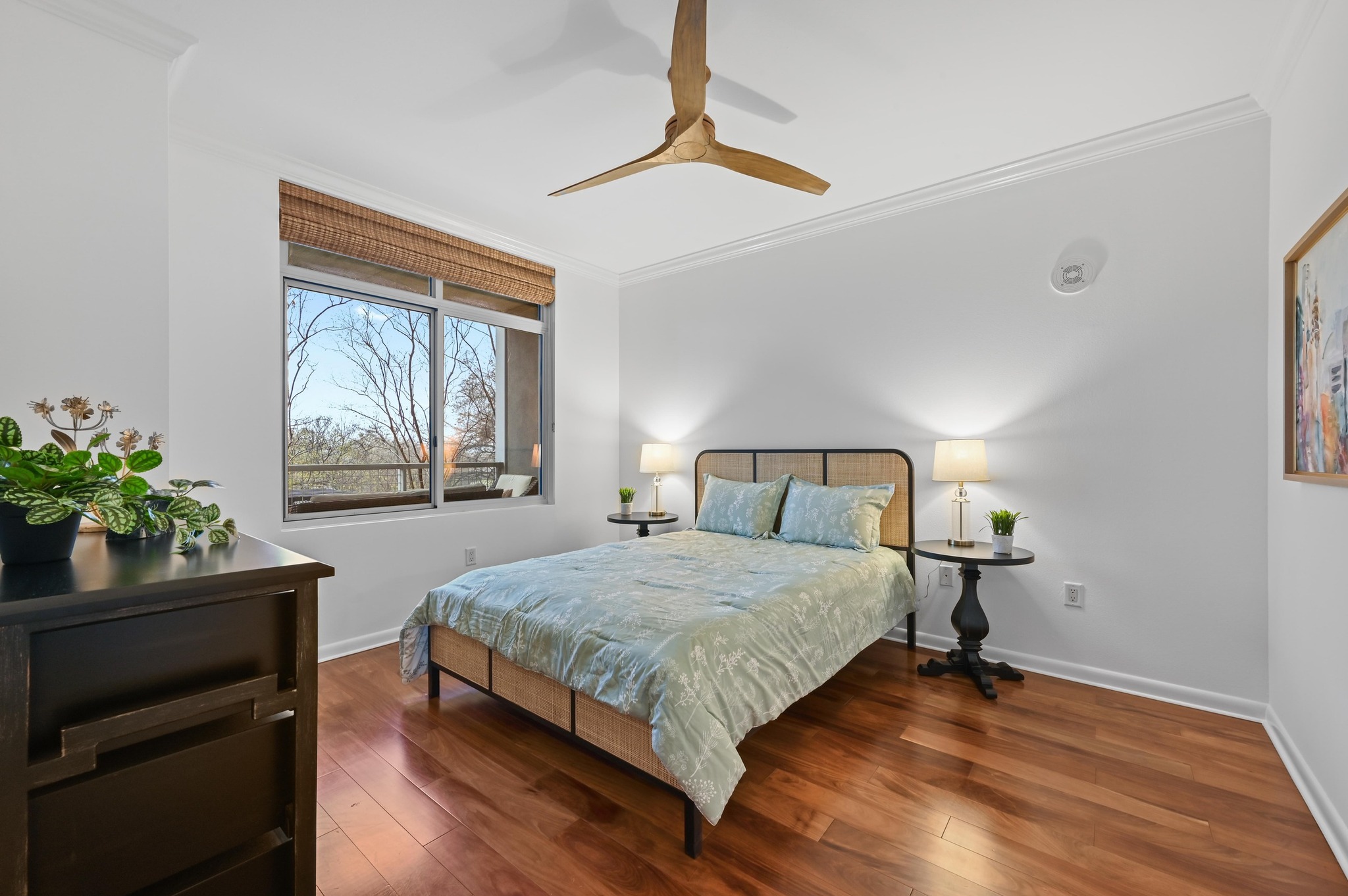 54 Rainey Street, Unit 412 Austin, TX 78701 - Photo 17 of 37 Bedroom with crown molding, wood floors, and ceiling fan