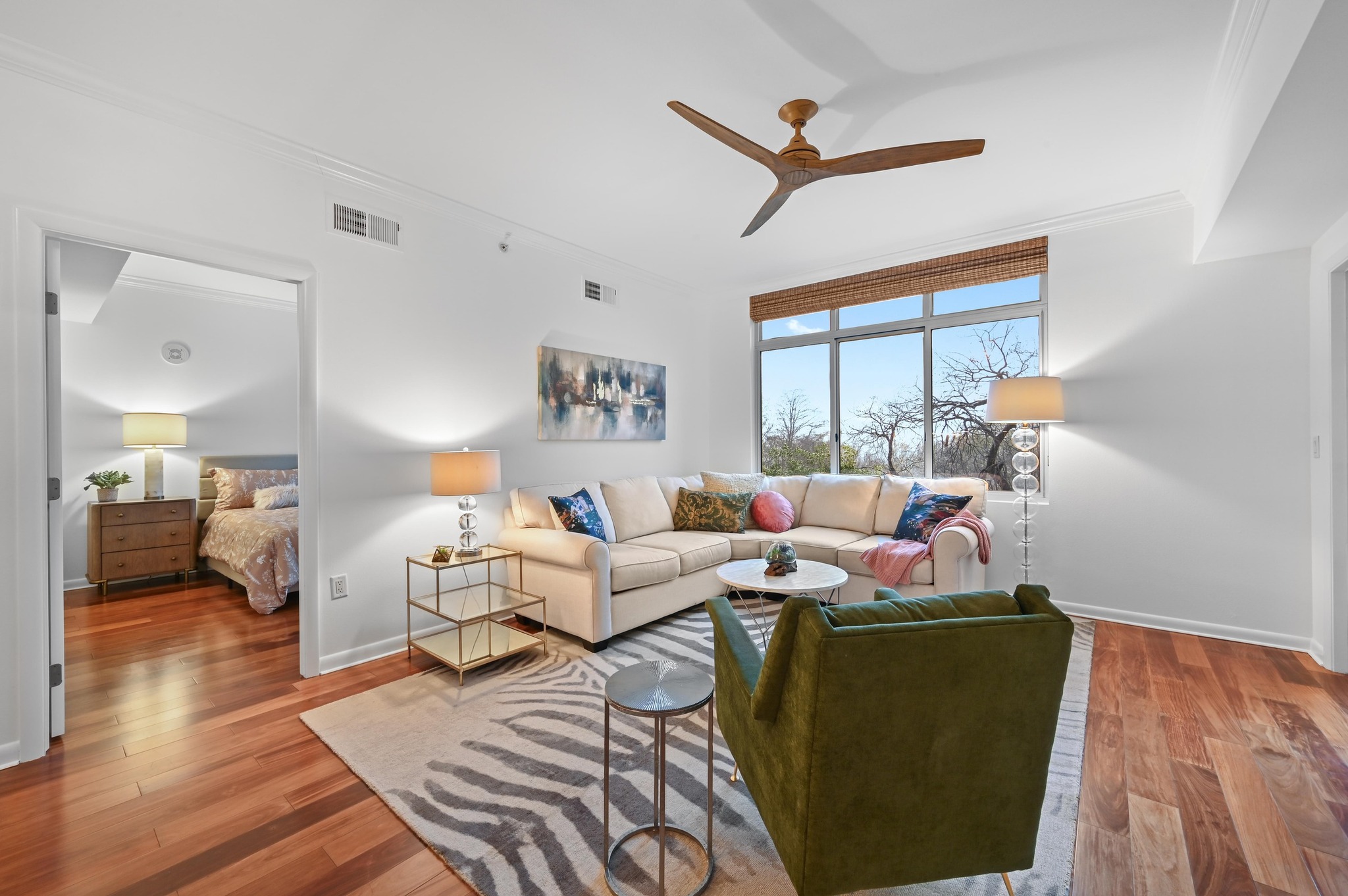 54 Rainey Street, Unit 412 Austin, TX 78701 - Photo 8 of 37 Living room featuring ornamental molding, wood floors, and ceiling fan