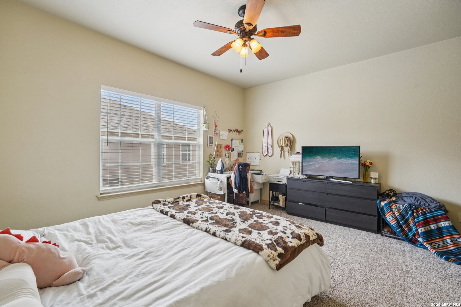 2312 Sailing Way, Unit B Kerrville, TX 78028 - Photo 16 of 25 a bedroom with a bed dresser and a window