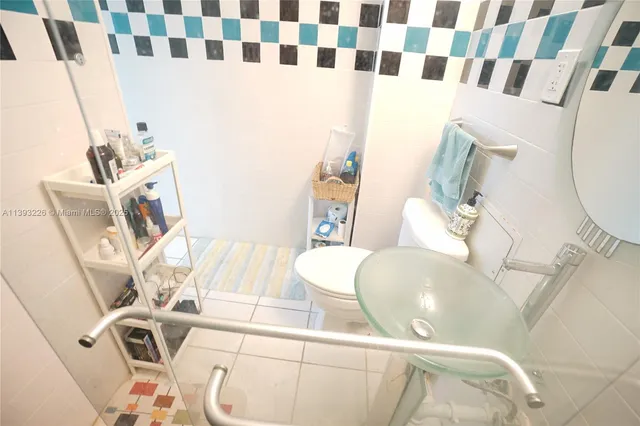 a bath tub sitting next to a shower