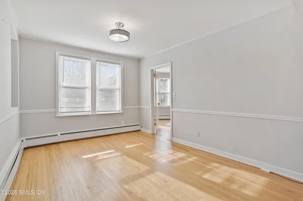 a view of an empty room with a window