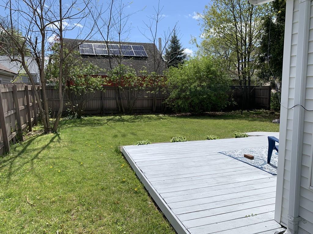 86 Russell Street Springfield, MA 01104 - Photo 23 of 23 a view of a backyard with a wooden fence