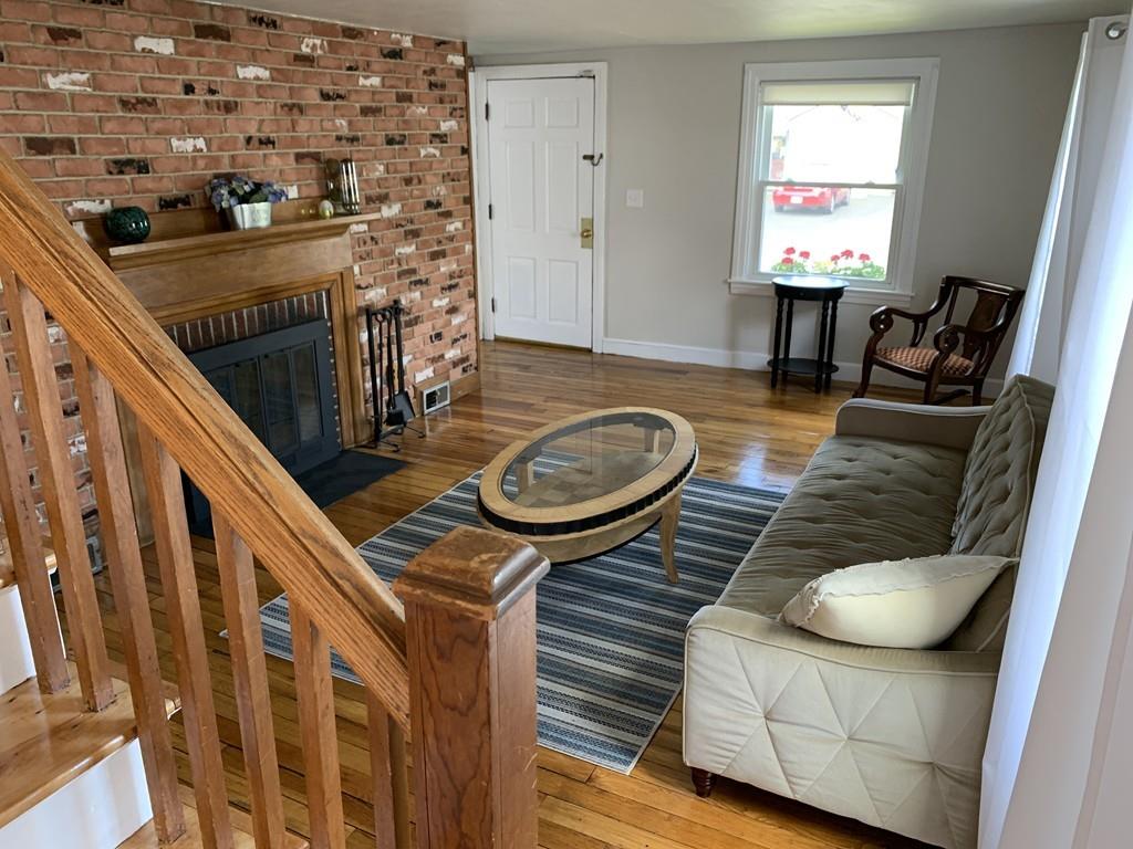 86 Russell Street Springfield, MA 01104 - Photo 6 of 23 a living room with furniture and a fireplace