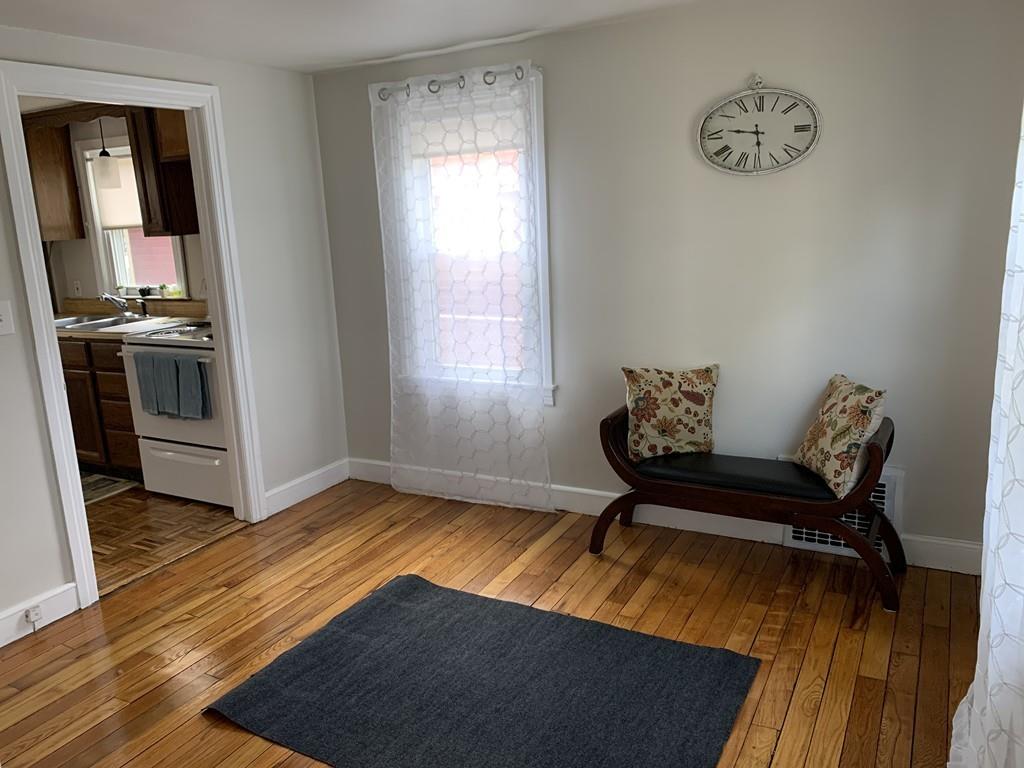 86 Russell Street Springfield, MA 01104 - Photo 9 of 23 a living room with furniture and a window