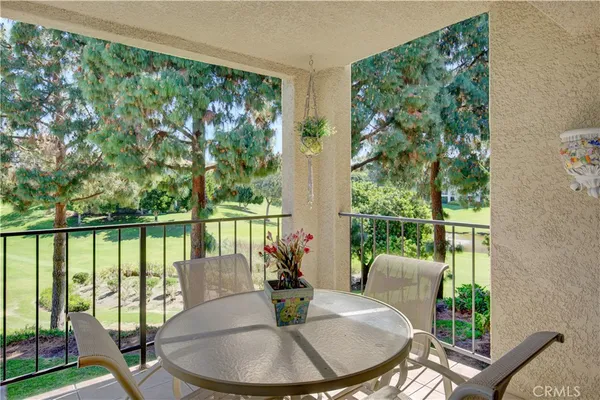 a view of a park with large trees