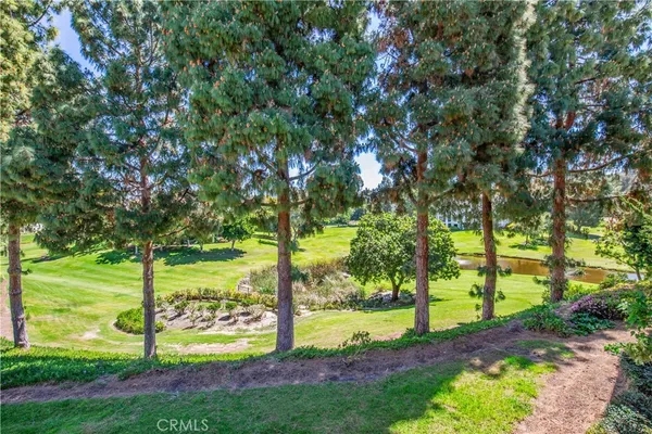 a backyard of a house with a yard and lake view